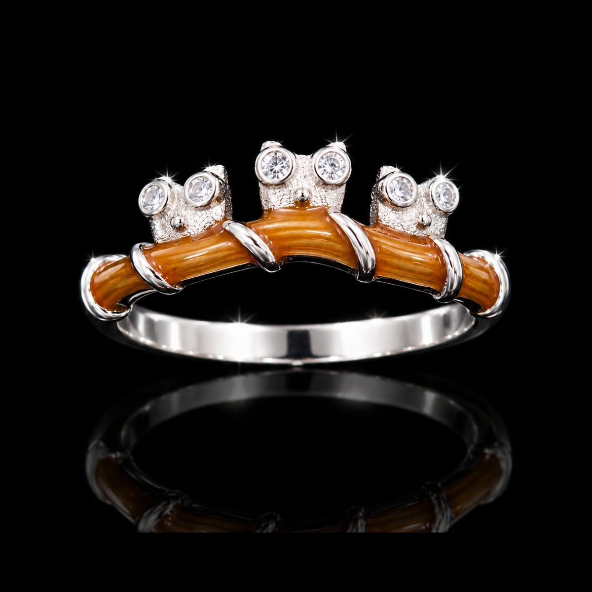 A silver ring with enamel and CZ stones on a black background.