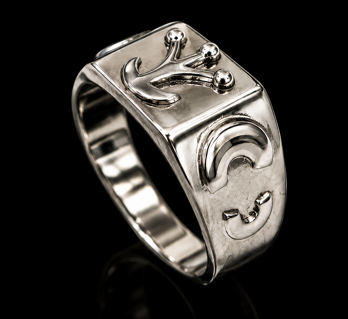 A silver signet ring with a modern design
