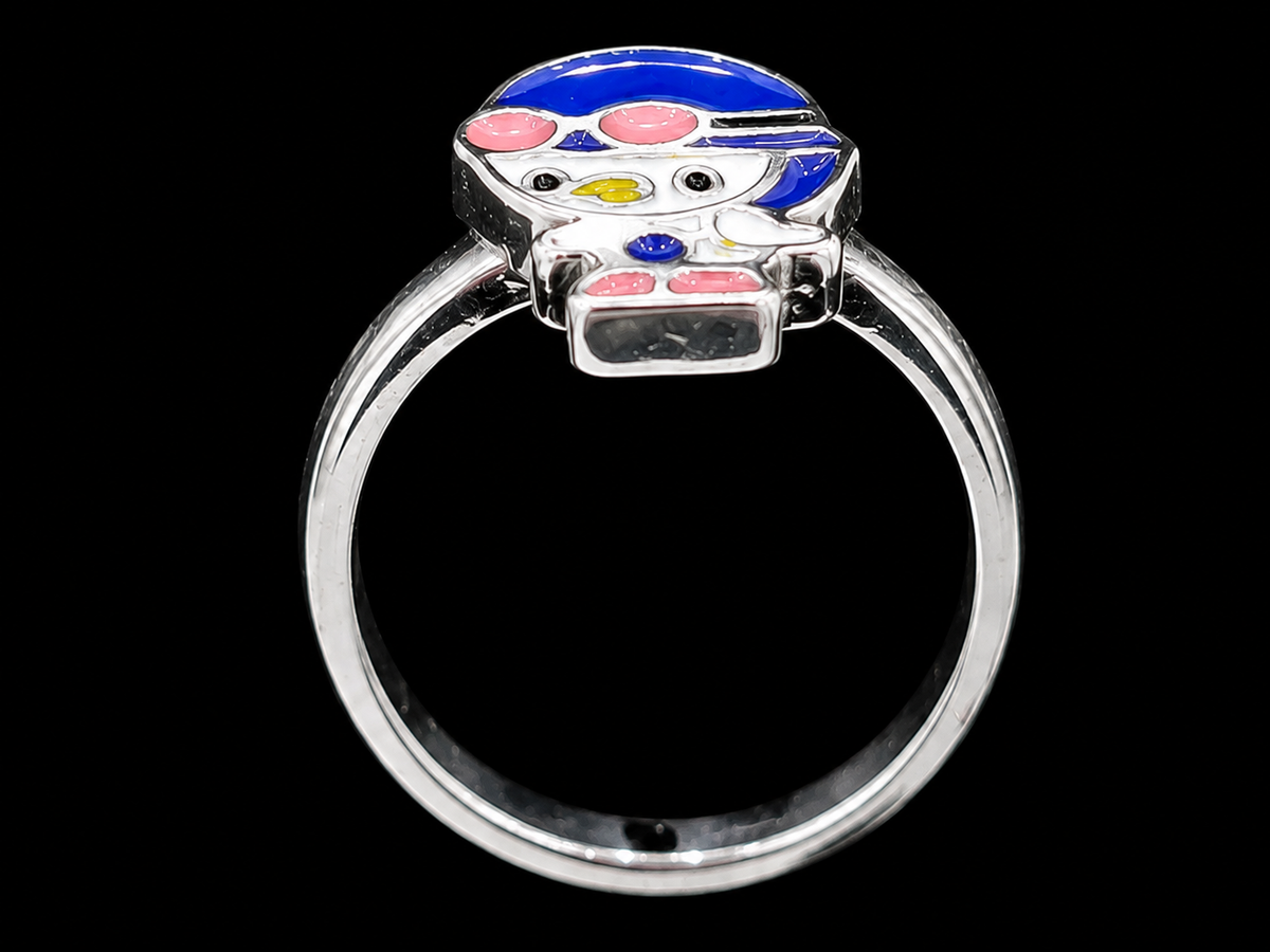 A silver-tone ring with a colorful enamel design.