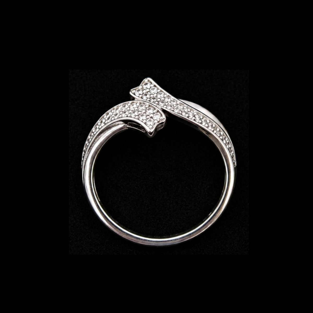 A silver ring with a CZ stone design.