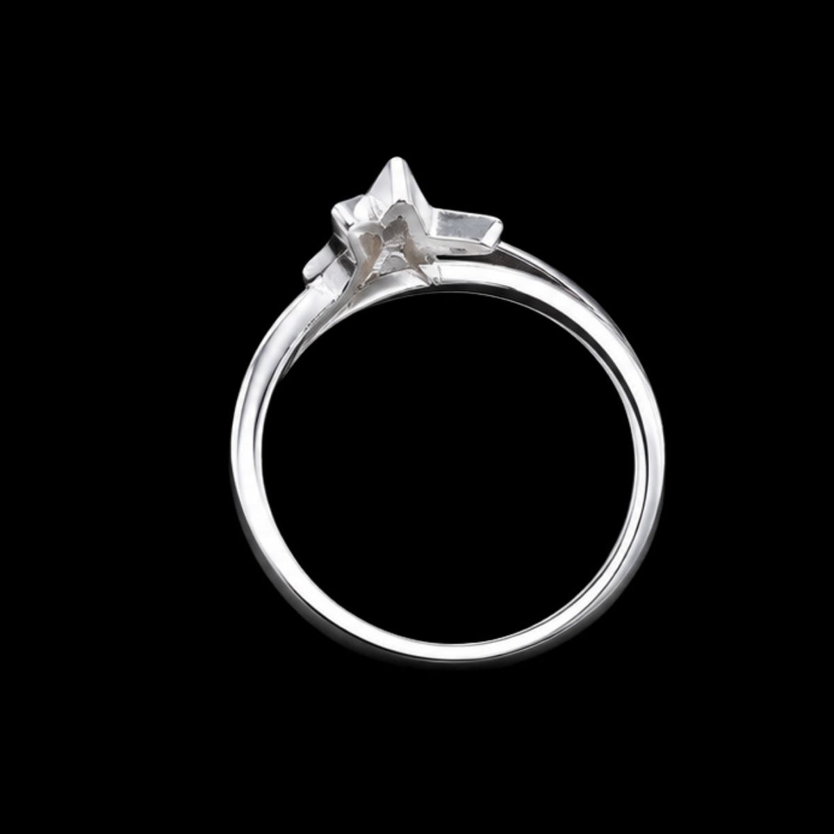 A silver ring with a star-shaped design and CZ stones.