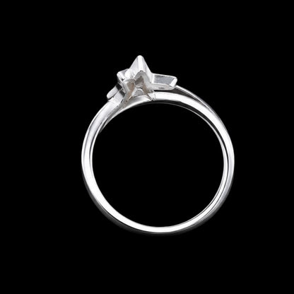A silver ring with a star-shaped design and CZ stones.