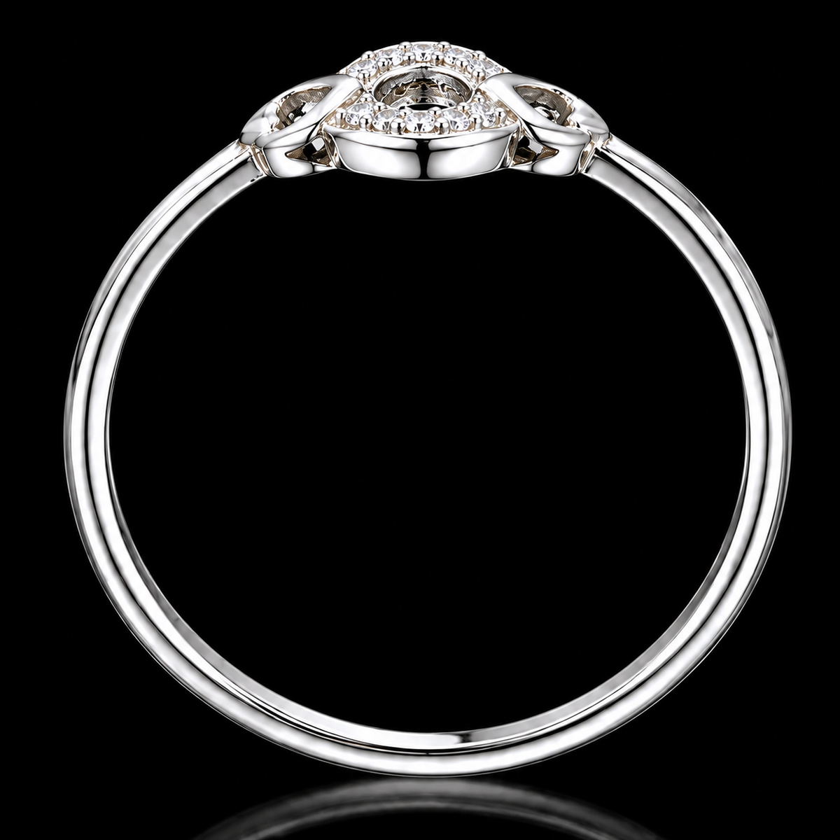 A silver ring with a round CZ stone at its center, surrounded by smaller CZ stones.