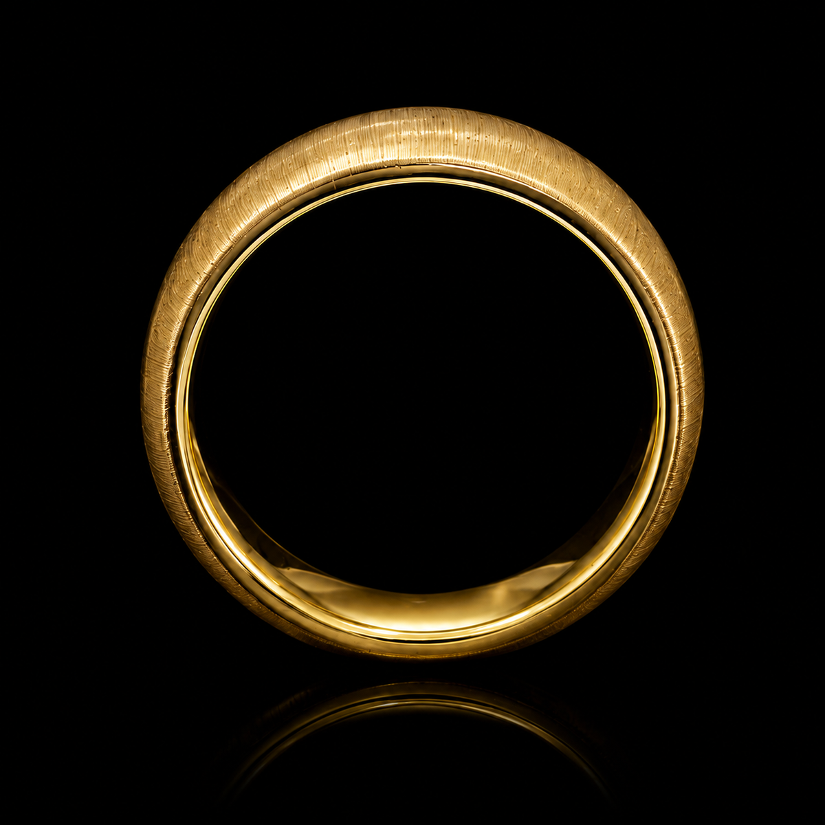 A gold ring with a textured finish.