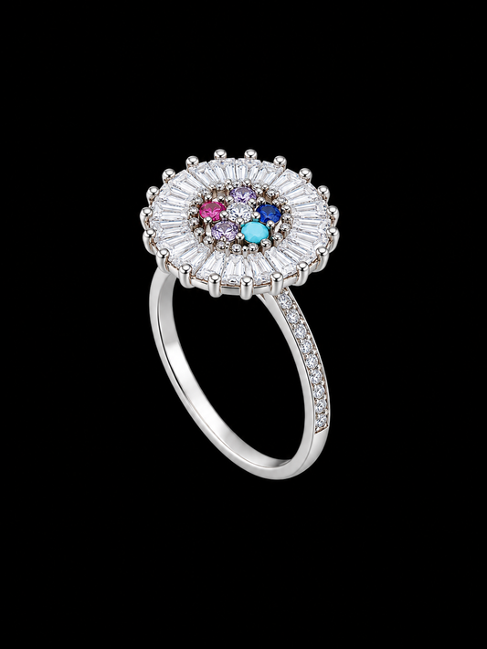 A silver-tone ring with a cluster of CZ stones in various colors.