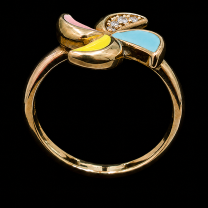 A gold-tone ring with a butterfly motif and pastel enamel wings, featuring clear CZ stones.