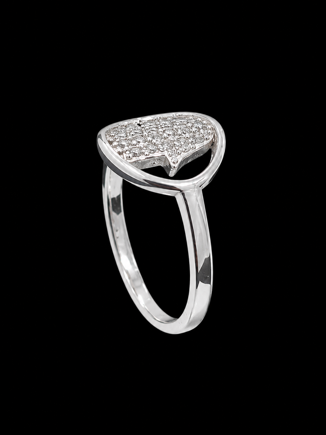 A silver ring with a CZ stone design, set against a light gray background.