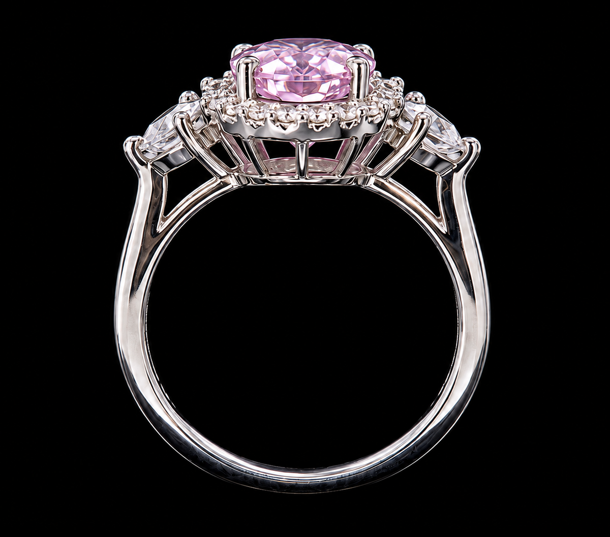 A silver ring with a pink CZ stone and clear CZ accents