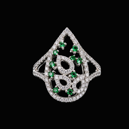 A silver ring with green CZ stones in a floral design.