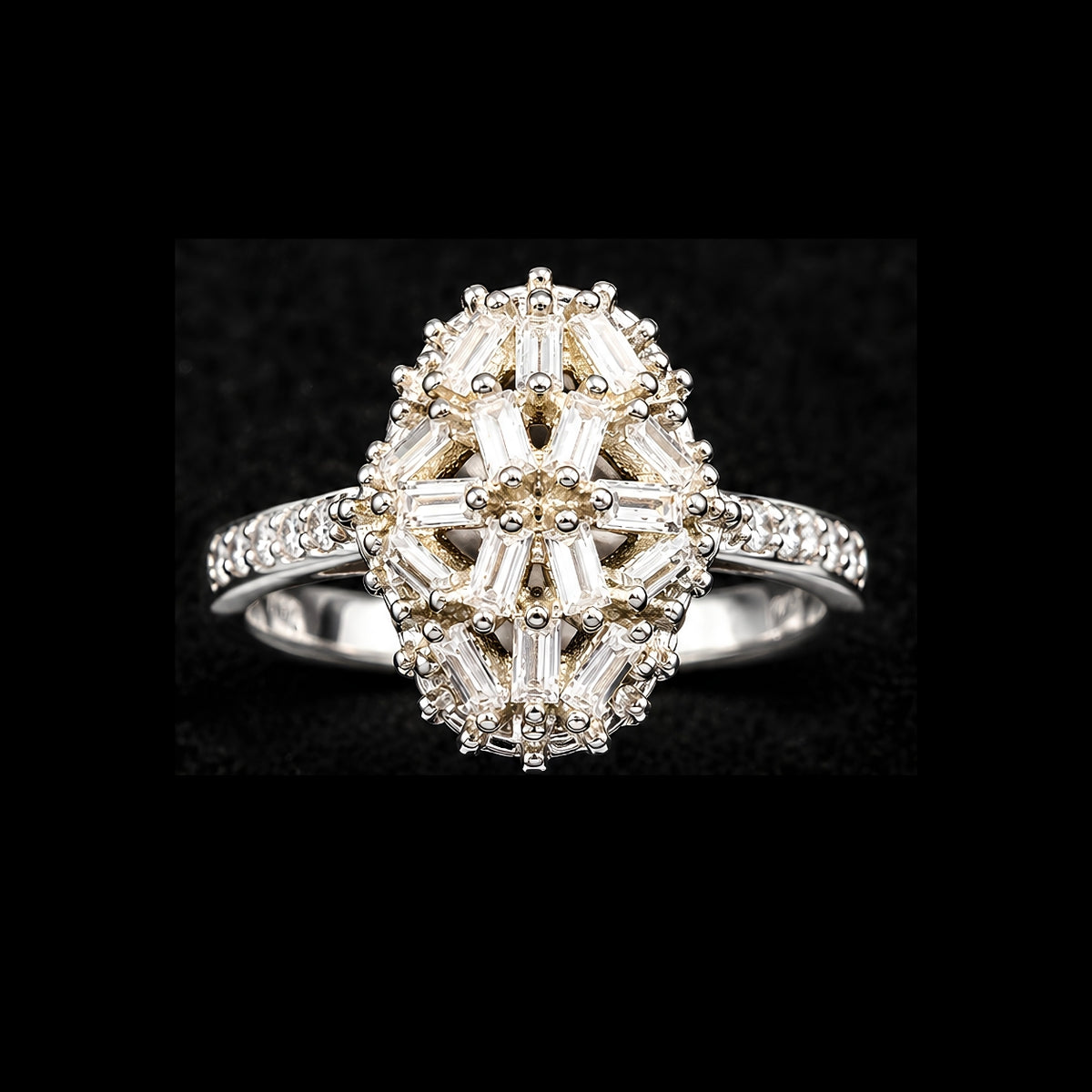 A gold-tone ring with a floral design and baguette CZ stones.