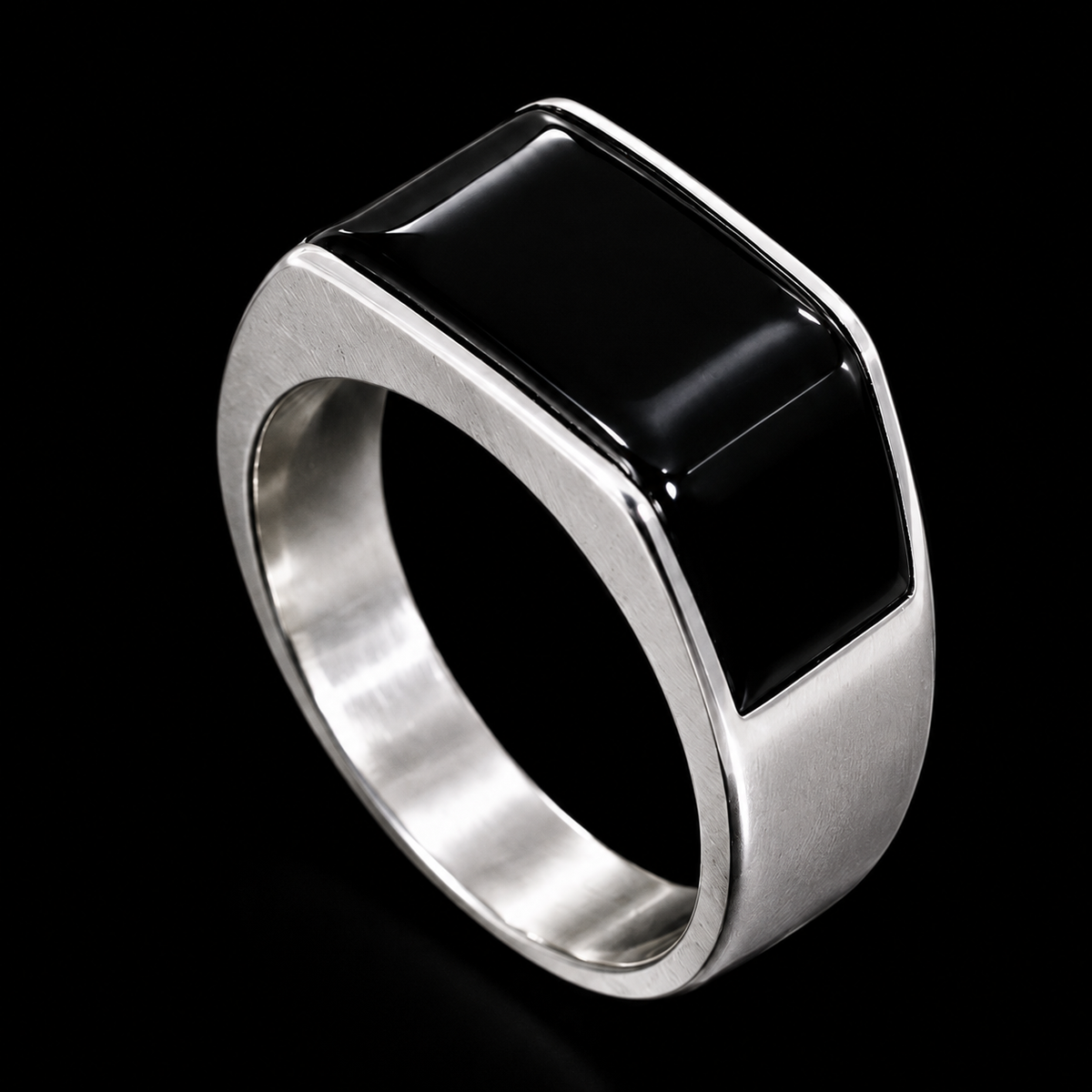 A silver ring with a large black square CZ stone.