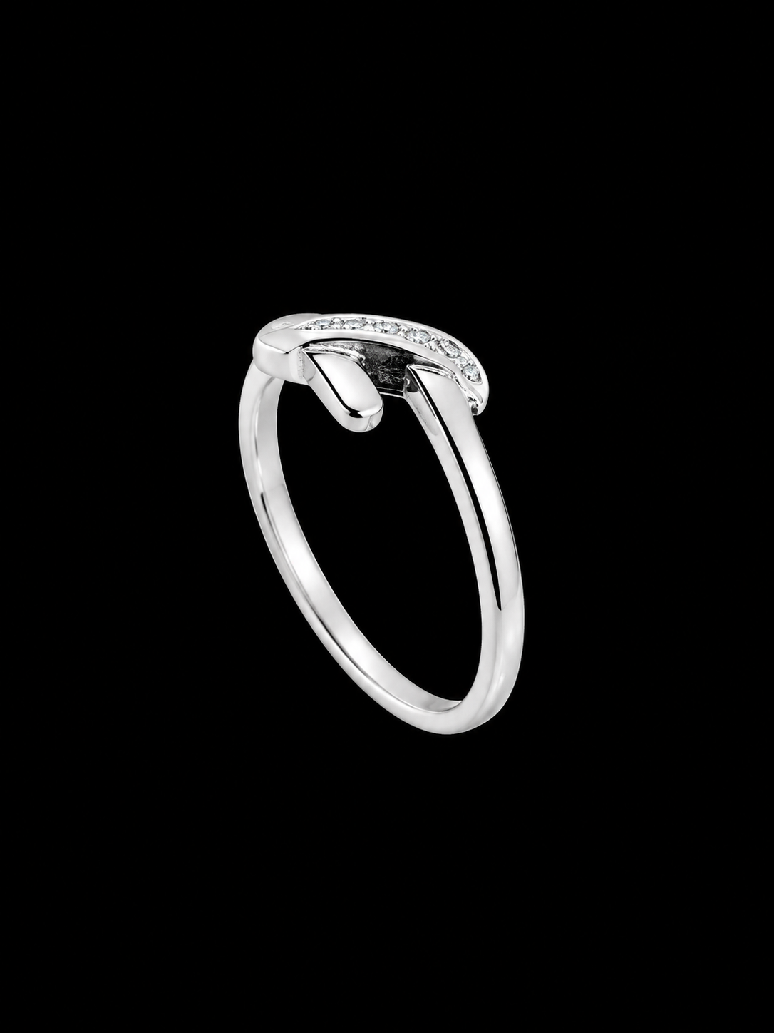 A silver ring with a curved band and small CZ stones along the top edge.