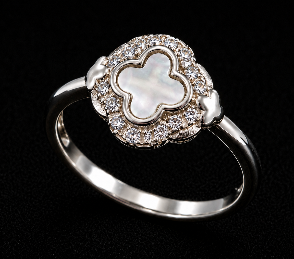 Silver ring with a four-leaf clover mother of pearl inlay and clear CZ stones