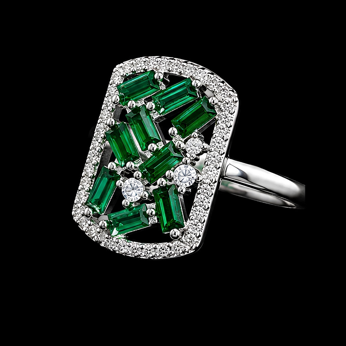 A silver-tone ring with emerald-cut green stones and round-cut clear stones.