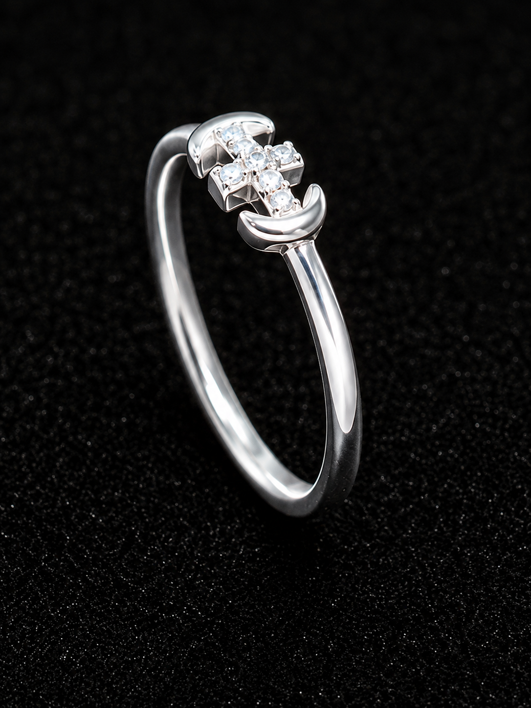 A silver ring with a row of clear cubic zirconia stones.