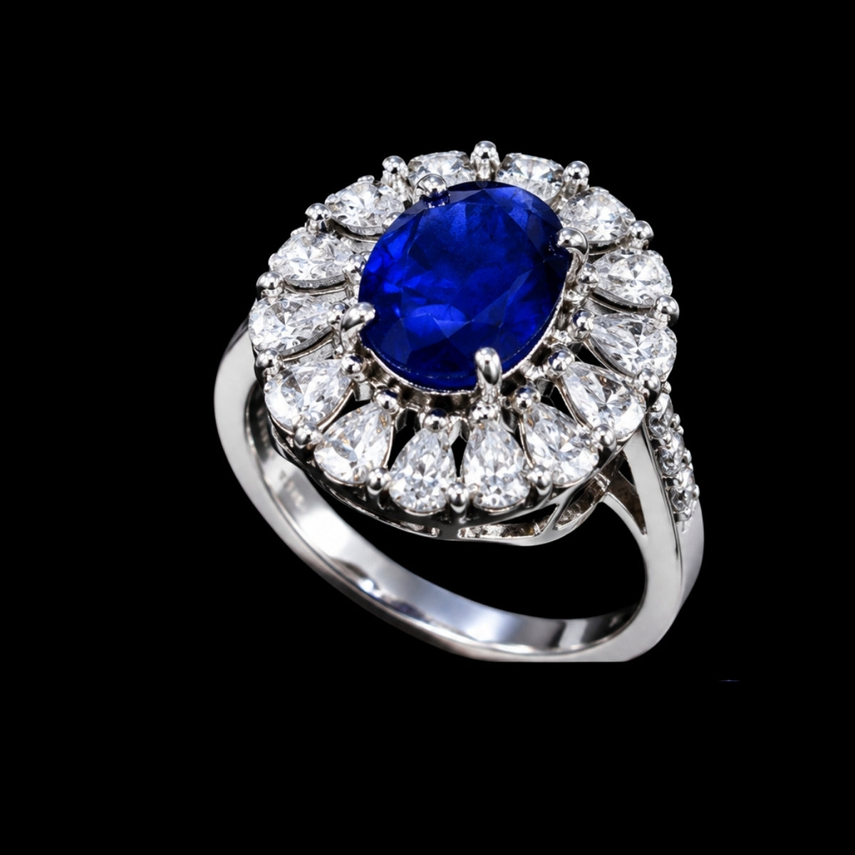 A silver-tone ring with a large blue sapphire stone and smaller clear stones.