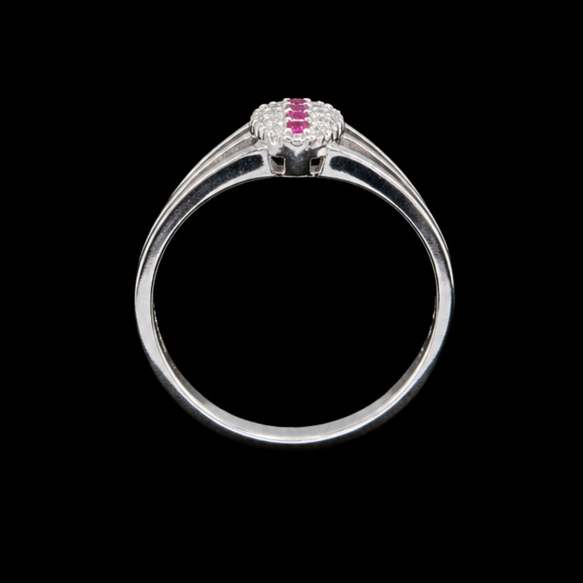 A silver ring with a cluster of pink cubic zirconia stones on a black background.