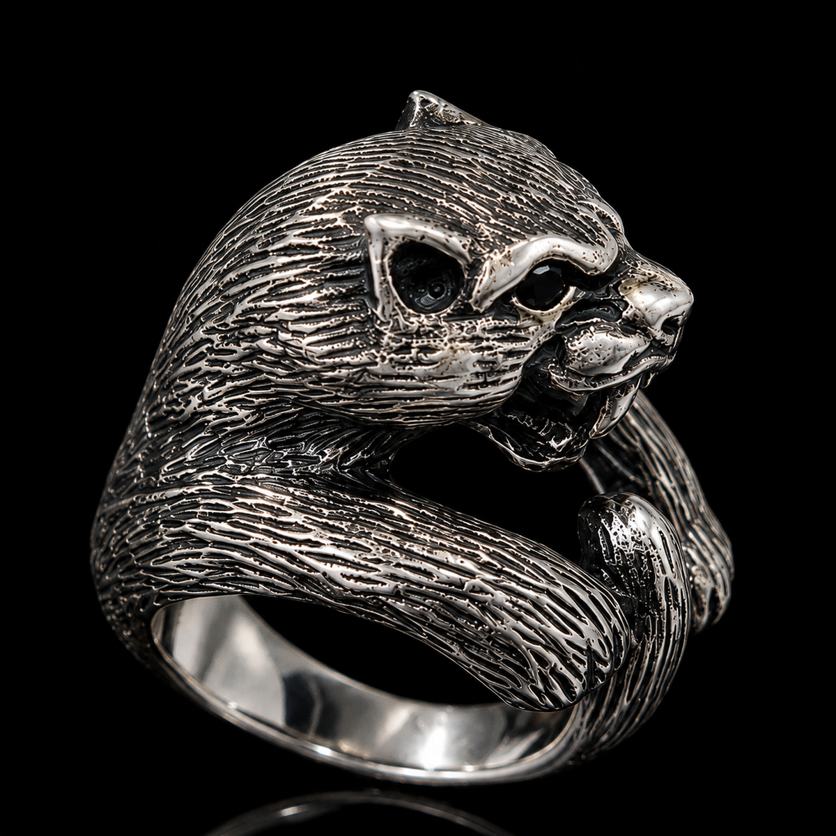 A silver ring with a detailed sloth design, featuring CZ stones.