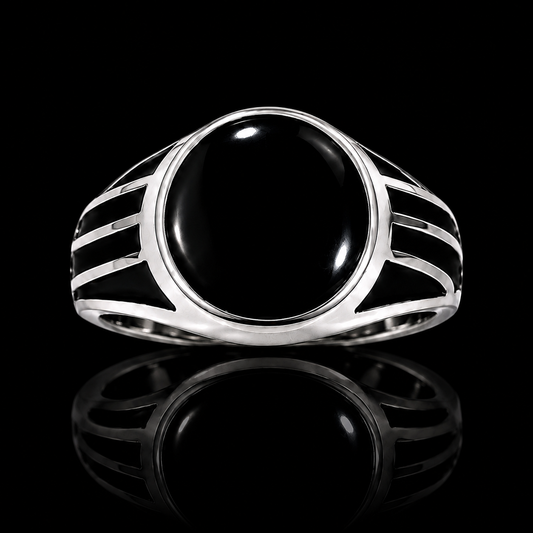 A silver-tone ring with a black onyx stone, set in a geometric design.
