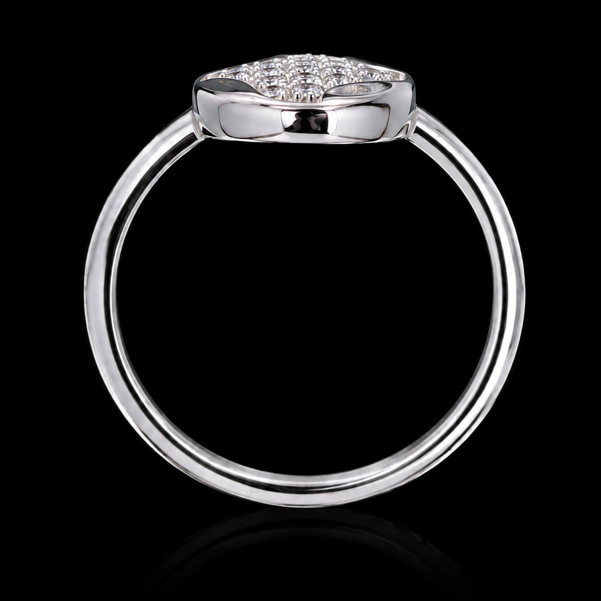 A silver ring with a cluster of clear cubic zirconia stones on a black background