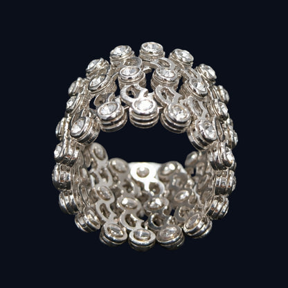 A silver ring with round-cut clear CZ stones.