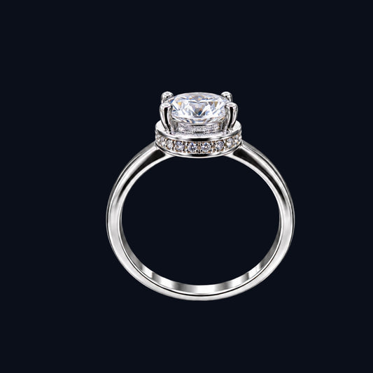 A silver ring with a large, clear CZ stone.