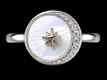 A silver ring with a crescent moon design and a star at its center, featuring CZ stones.