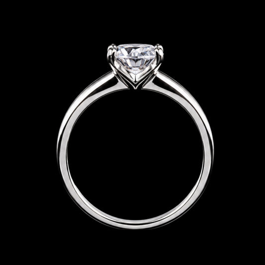 A silver ring with a large diamond in the center, set in a simple band.