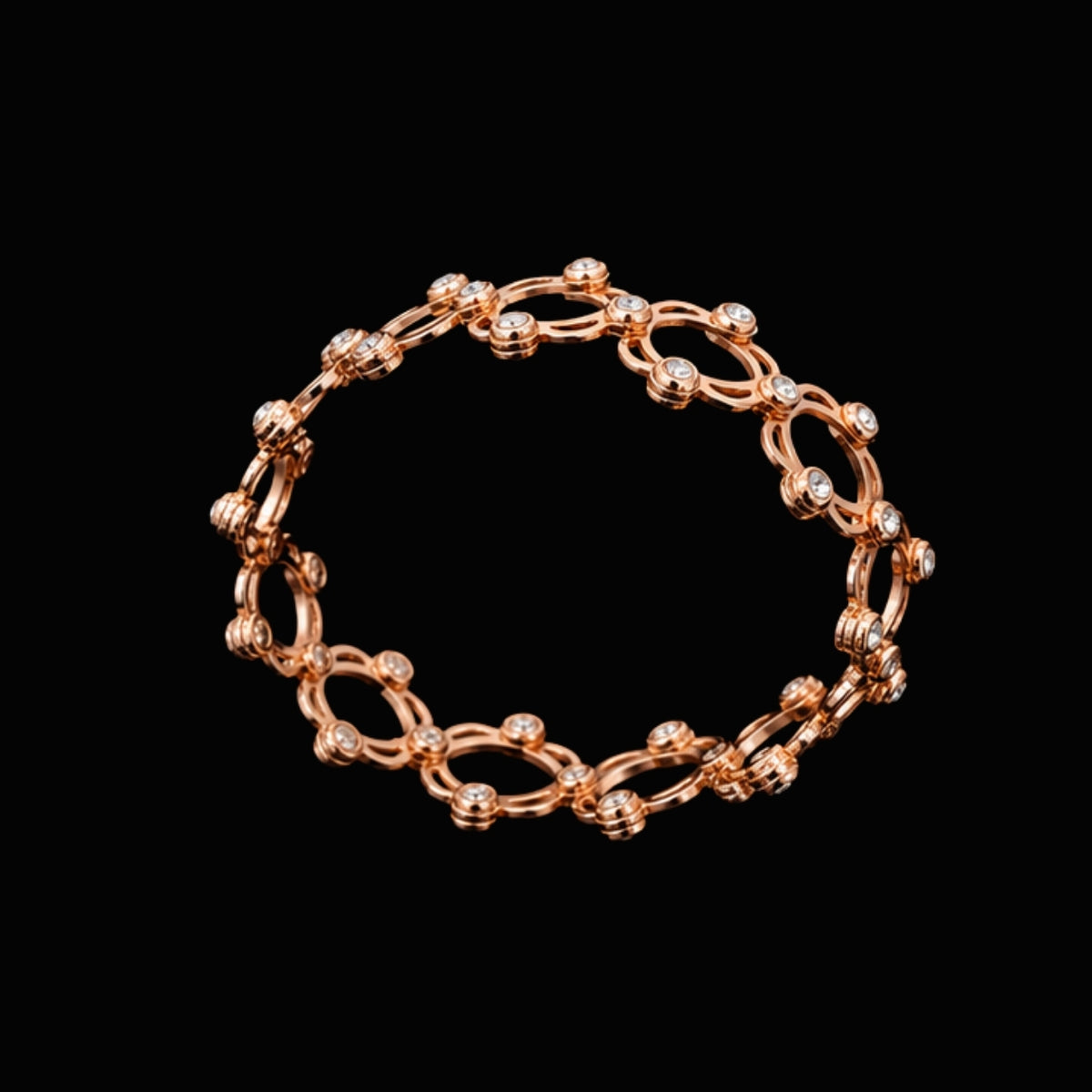 A rose gold chain link bracelet with CZ stones