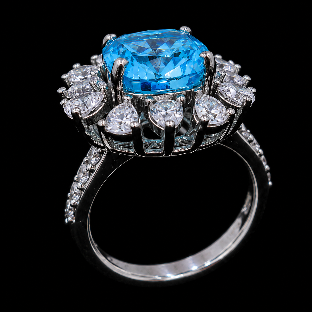 A silver ring with a large blue gemstone and small clear gemstones on a black background.