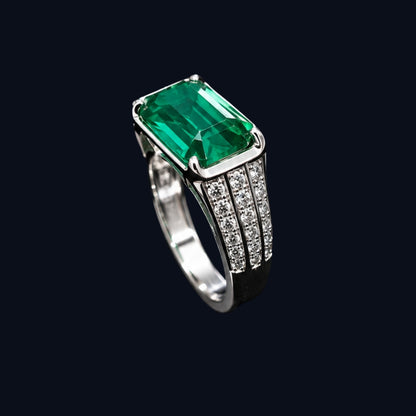A silver ring with an emerald-cut design and CZ stones