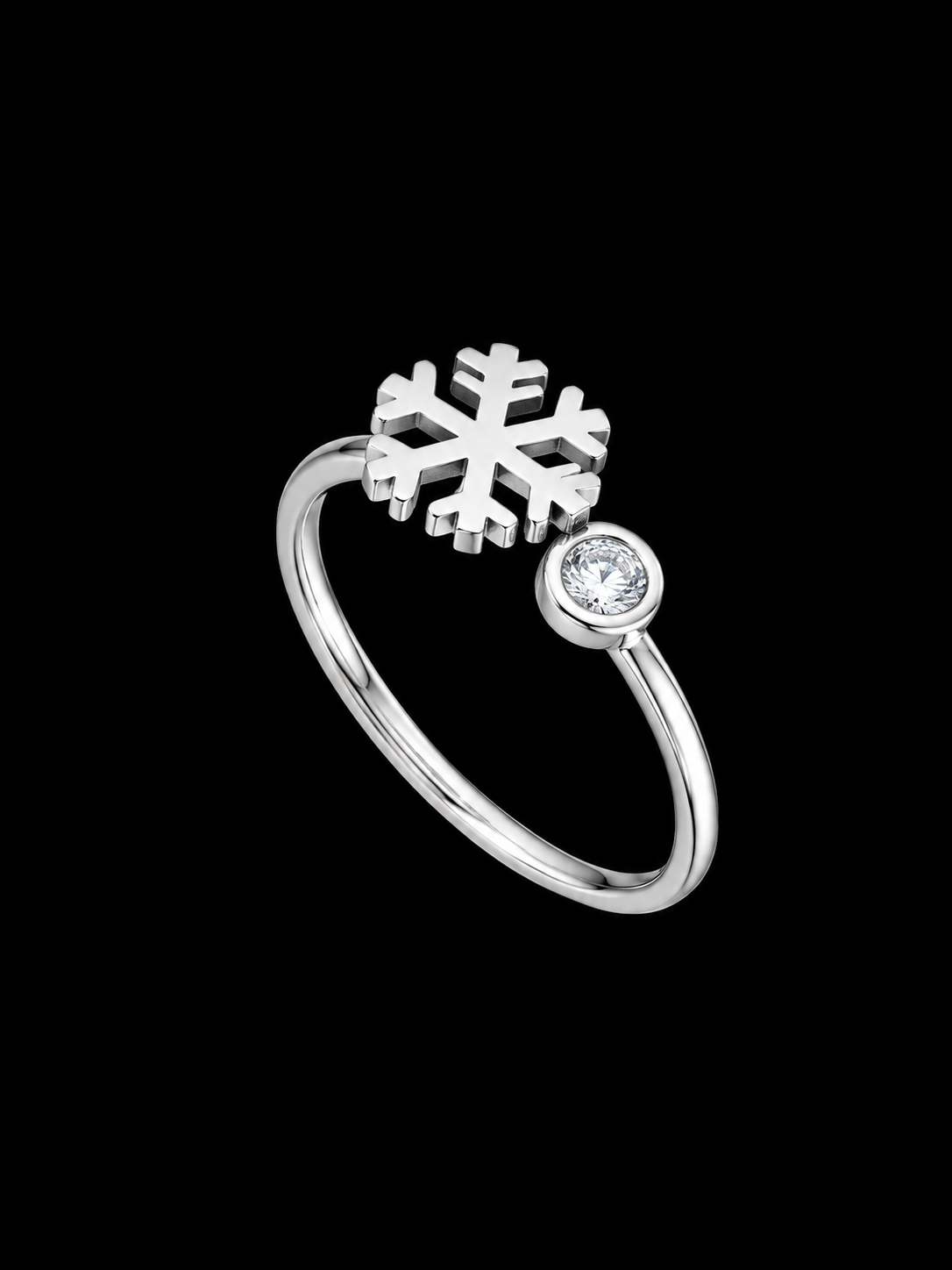 A silver ring with a snowflake design and a CZ stone.