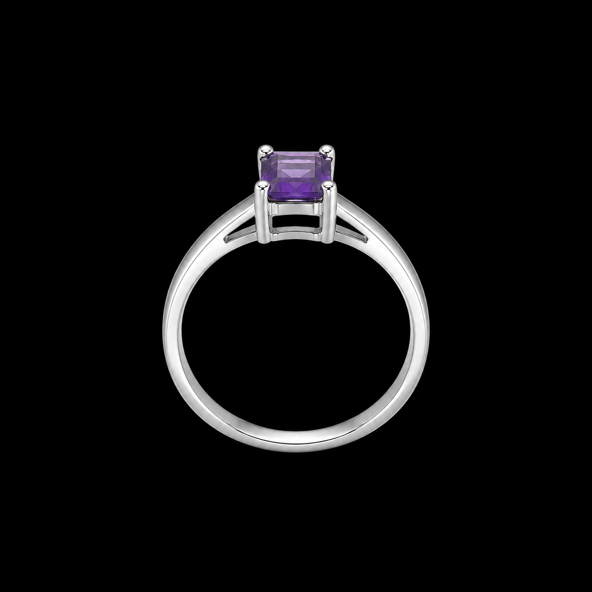 A silver ring with a purple gemstone on a black background