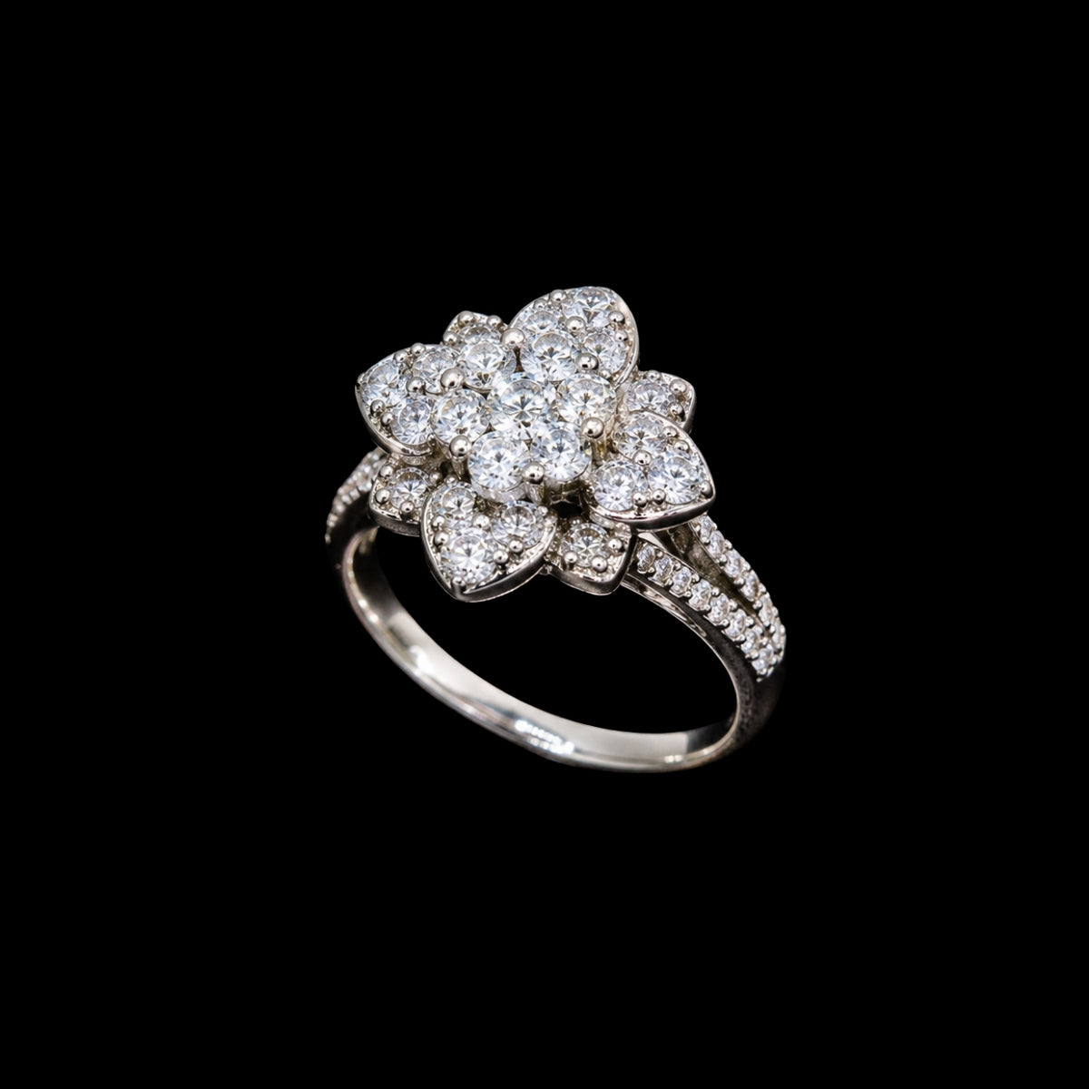 A silver ring with a floral design and clear CZ stones.