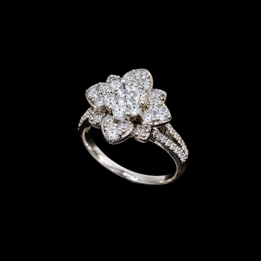 A silver ring with a floral design and clear CZ stones.
