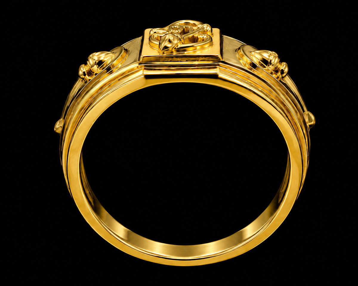 A gold ring with intricate enamel work on a black background
