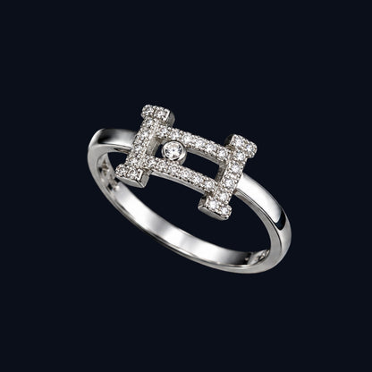 A silver-tone ring with a geometric design and clear cubic zirconia stones.