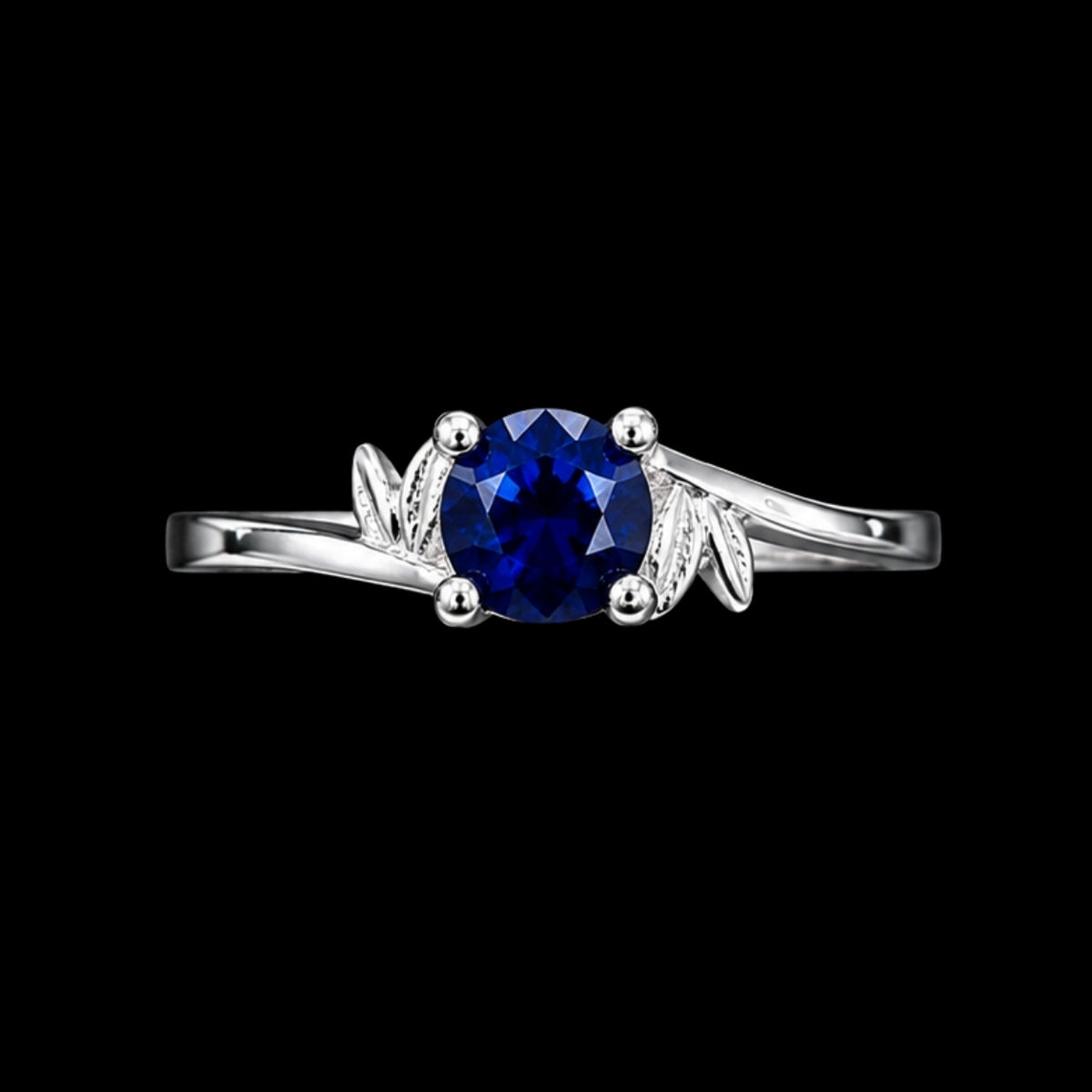 A silver-tone ring with a round-cut blue CZ stone